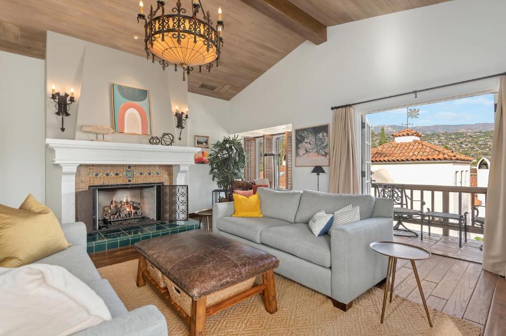 a living room with a couch and a fireplace at La Vida Riviera in Santa Barbara