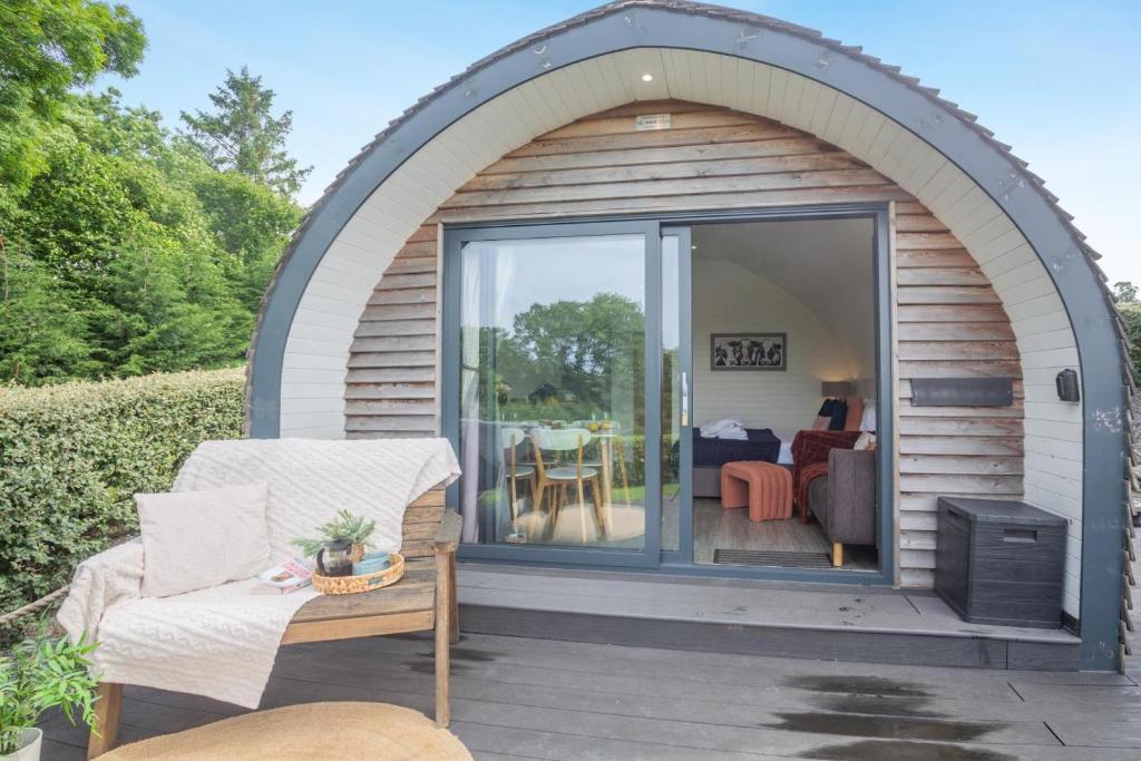 a gazebo with an arched door and a patio at 2 Bed in Corwen oc-80318 in Gwyddelwern