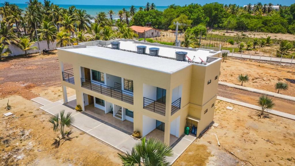 an overhead view of a house on the beach at El Viento Beach Apartamentos in San Bernardo del Viento