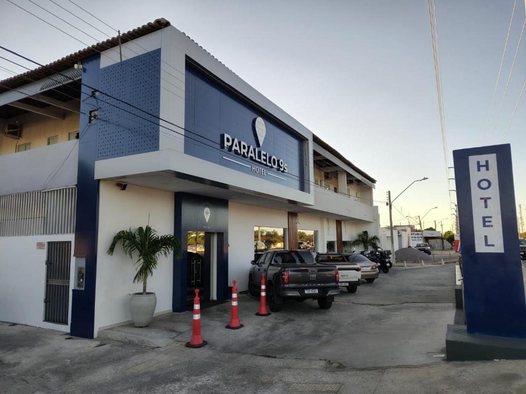 a parking lot in front of a parking garage at PARALELO 9s HOTEL in Petrolina
