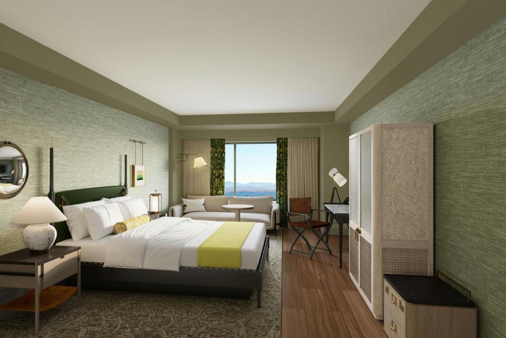 a hotel room with a bed and a desk at The Harborvale, Autograph Collection in Burlington