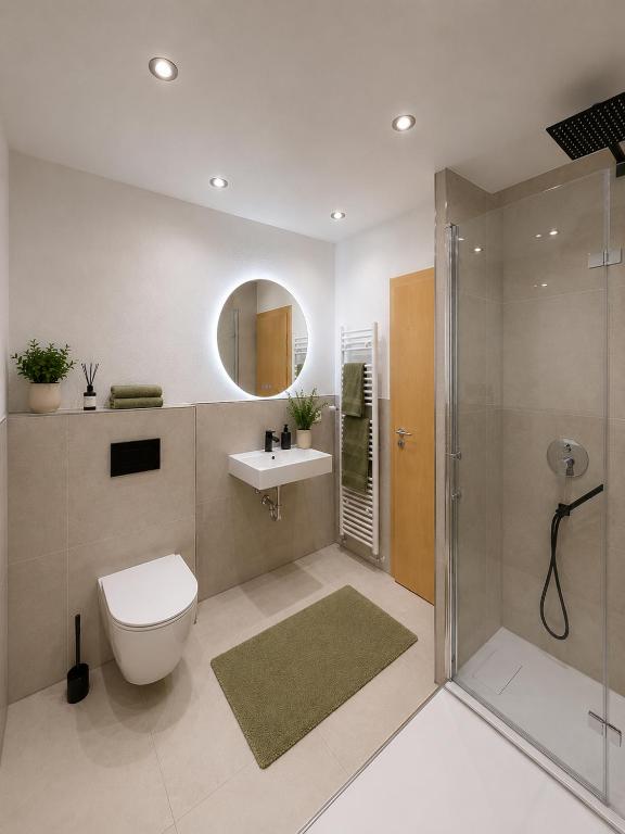 a bathroom with a toilet and a sink and a shower at Altmühl Hideaway Apartment 2 in Treuchtlingen