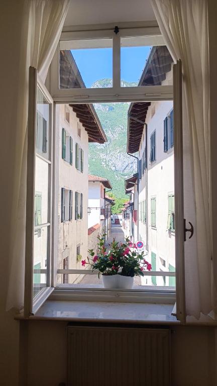an open window with a view of a city street at Affittacamere Borgo Antico in Venzone