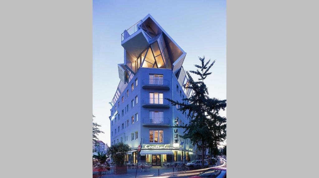 an architectural rendering of a tall blue building at Chelsea Hotel in Cologne