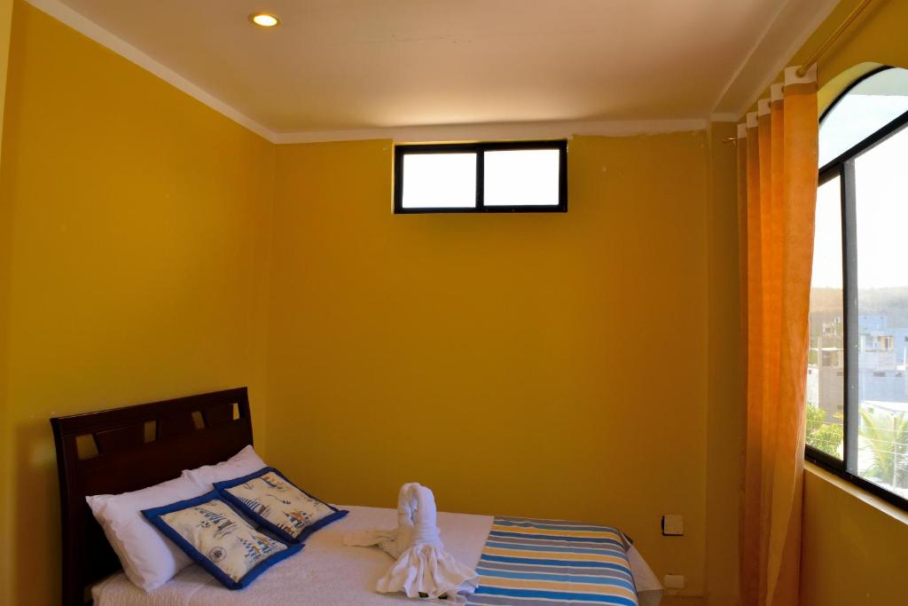 Postel nebo postele na pokoji v ubytování Hostal Duncan
