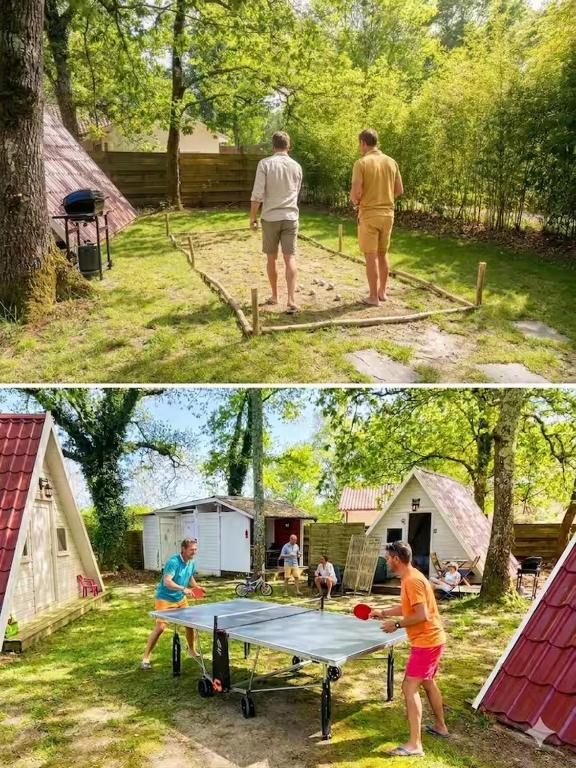 two people standing around a ping pong table in a yard at Cabanoù Lodge & Spa in Messanges