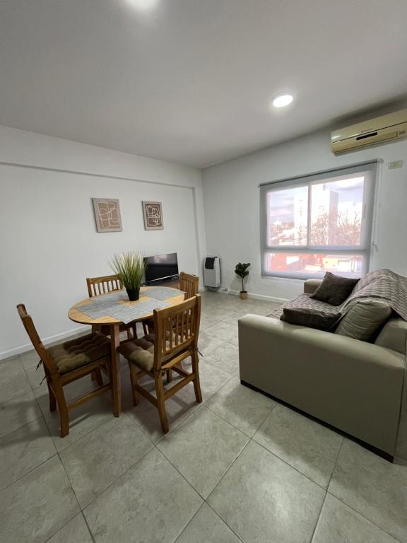 a living room with a couch and a table at MyN 2 in La Plata