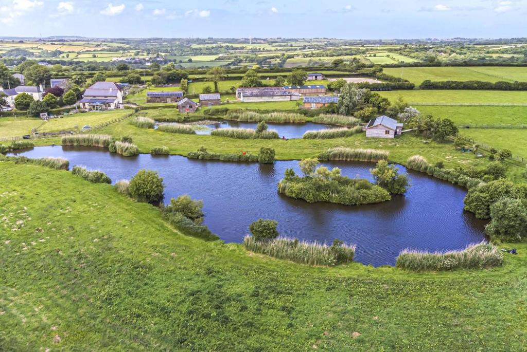 an aerial view of a river in a field at 3 Bed in Shebbear oc-l32583 in Shebbear