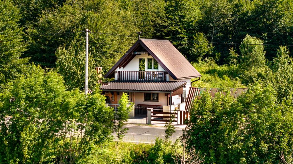 a small house in the middle of a forest at Velebit House in Baške Oštarije