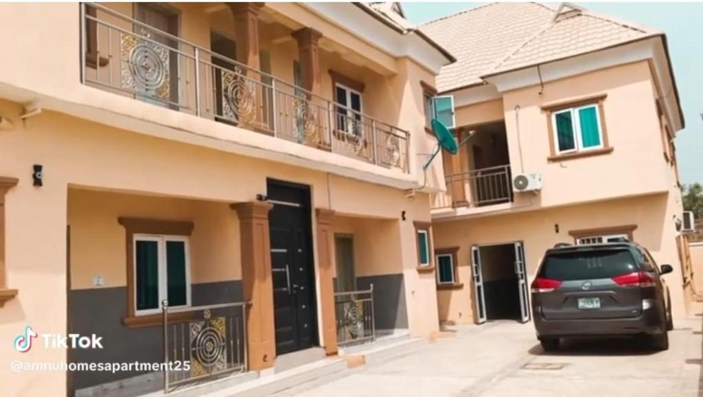 a car parked in front of a building at Amnu Homes Apartment in Ilorin