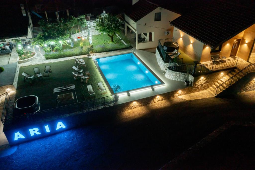an overhead view of a swimming pool at night at Aria in Cetinje