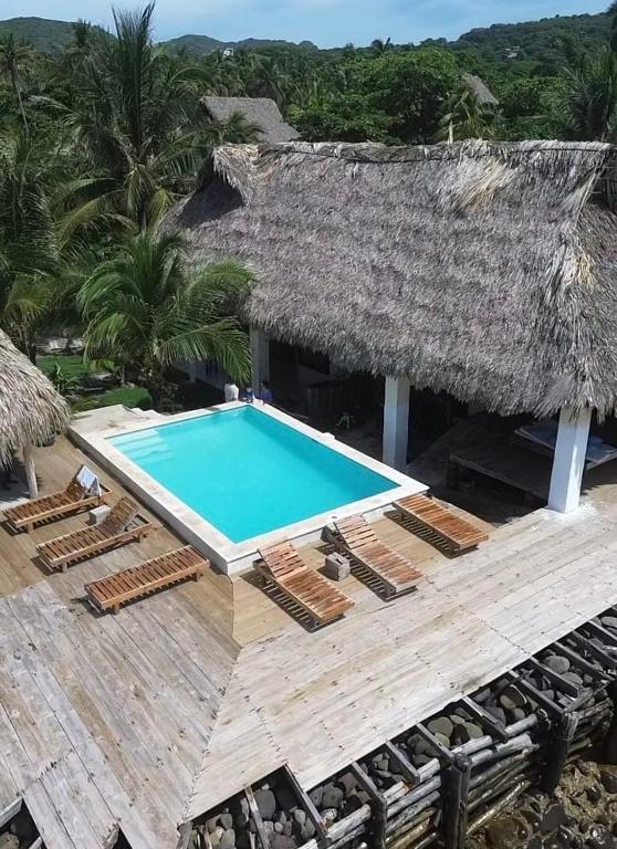 an aerial view of a resort with a swimming pool at Punta El Zonte in El Zonte