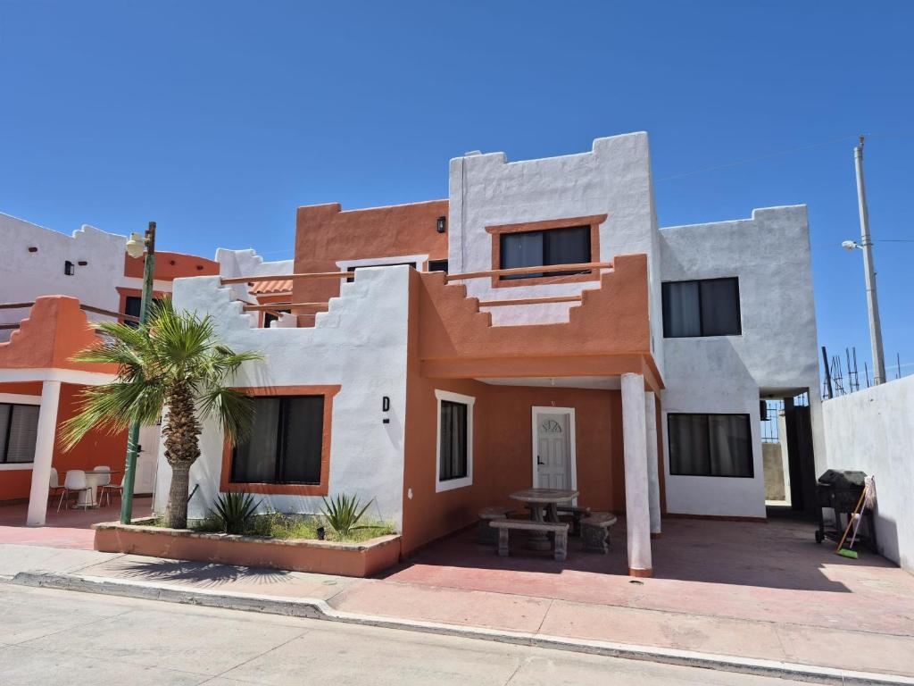 a house in the middle of a street at Bugambilias Condo D with Pool and Beach Access - Rancho Bugambilias in San Felipe