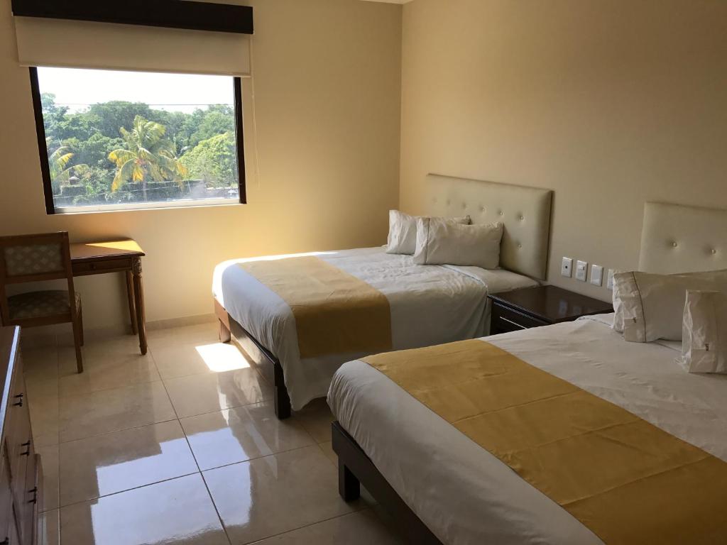 Tempat tidur dalam kamar di Hotel Del Viajero