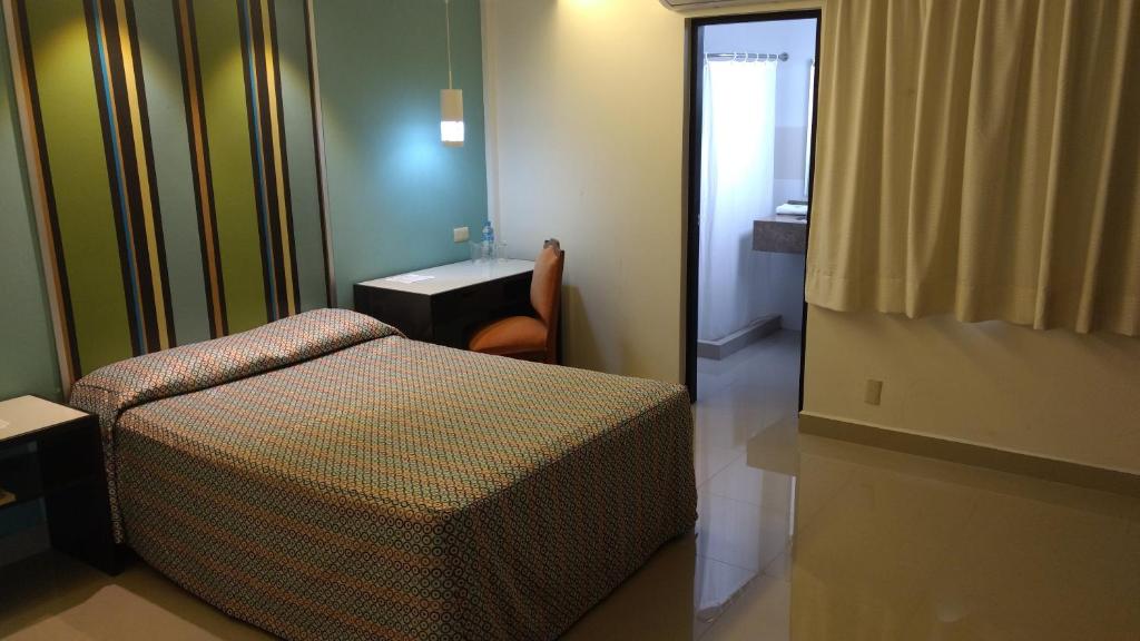 Postel nebo postele na pokoji v ubytování Hotel Mar y Tierra
