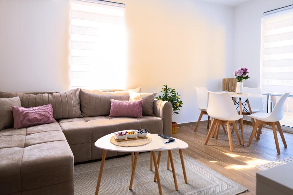 a living room with a couch and a table at Lighthouse Kotor in Prčanj