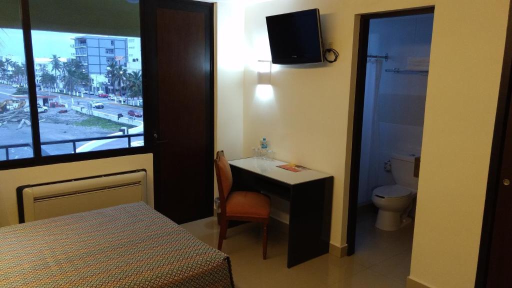 Postel nebo postele na pokoji v ubytování Hotel Mar y Tierra