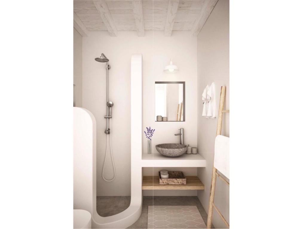 a bathroom with a shower and a sink at Serifos Blue in Rámos