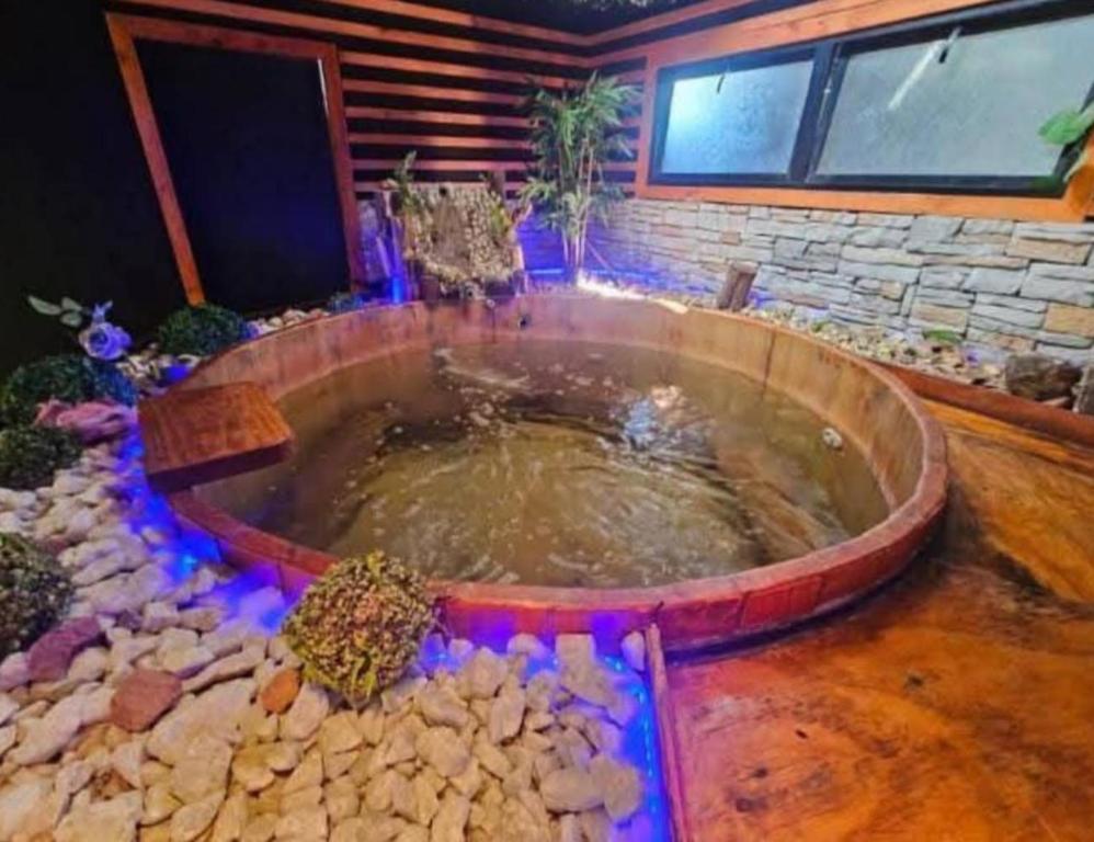 a large tub filled with water in a room at Hipolito in La Serena