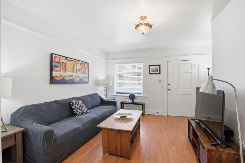 a living room with a couch and a tv at Golden Hill 1 bedrooms in San Diego