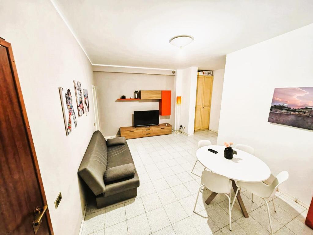 a living room with a couch and a table at GaribaldiCentrePort in Ancona