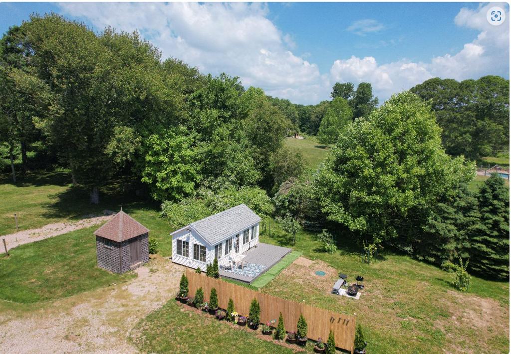 an overhead view of a small house in a field at Lakefront Guesthouse w Sunrise View Dock in Stonington