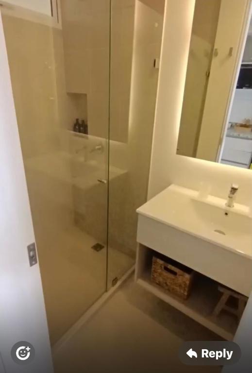 a bathroom with a shower and a sink and a mirror at Santa Martha-Apartment- Ocean view in Mirabel