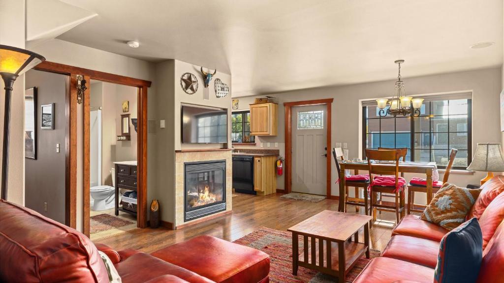 a living room with a couch and a fireplace at The Buckeye in Red Lodge