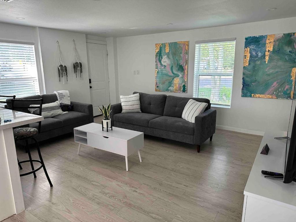 a living room with a couch and a table at Cozy Apartment in Brownsville