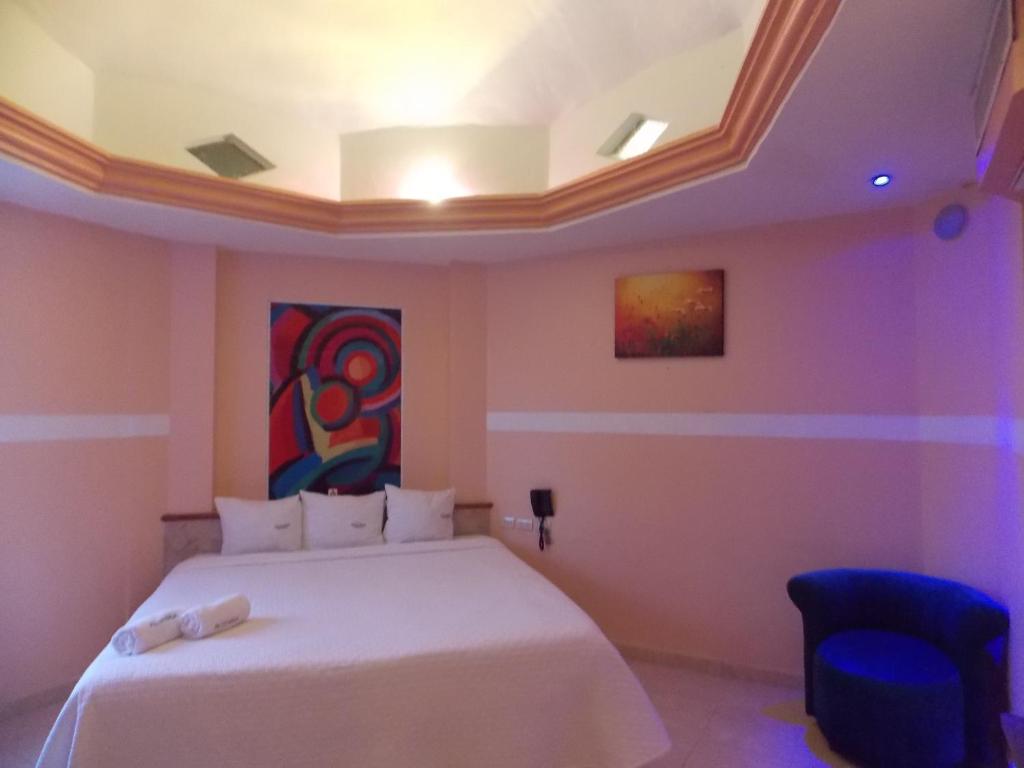 Postel nebo postele na pokoji v ubytování Hotel Express Alejandría