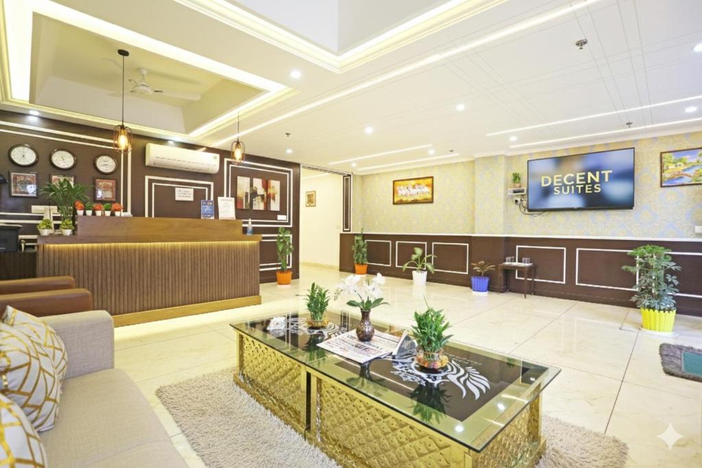 a lobby with a waiting room and a dental office at Hotel Decent Suites - Delhi Airport in New Delhi