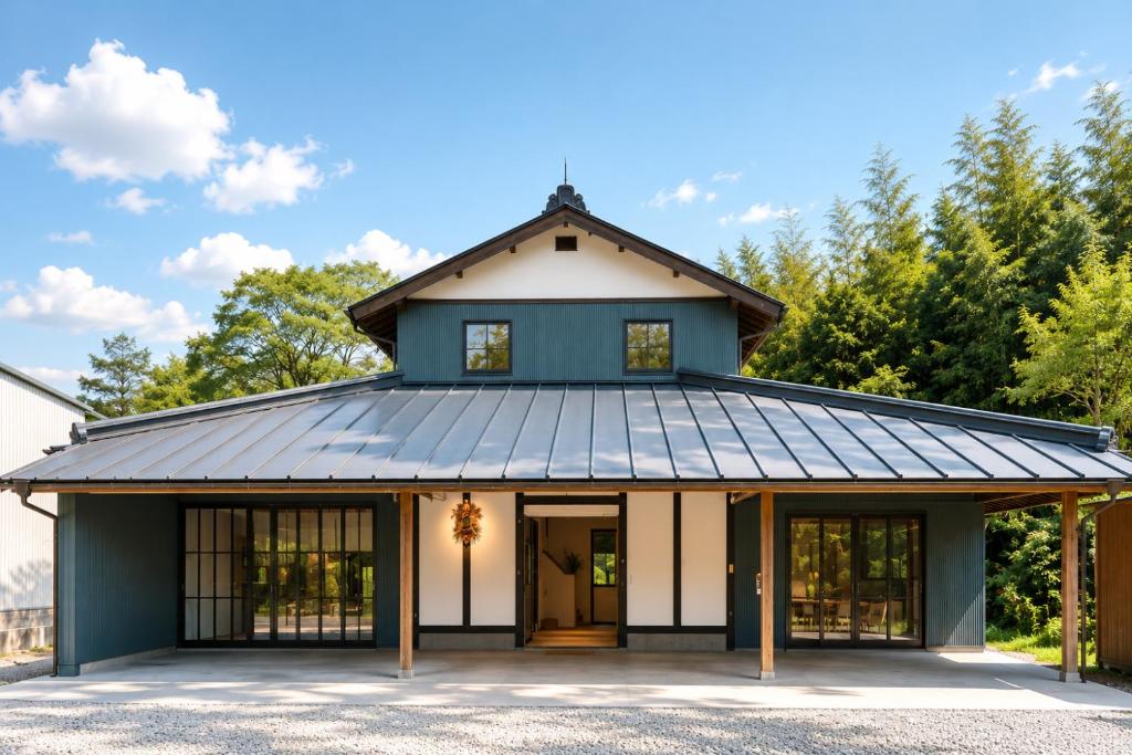 a house with a gambrel roof with a garage at 日和のすみか in Ichihara