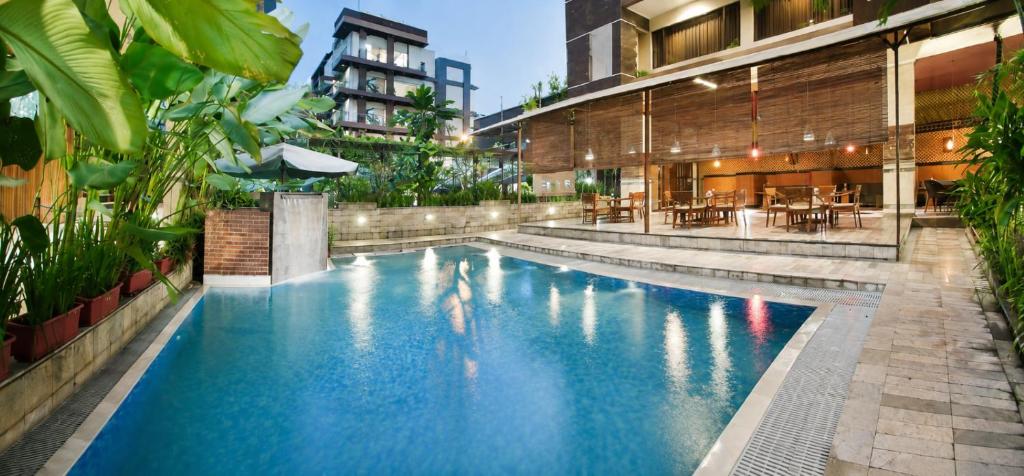 a swimming pool in the middle of a building at Bali World Hotel in Bandung
