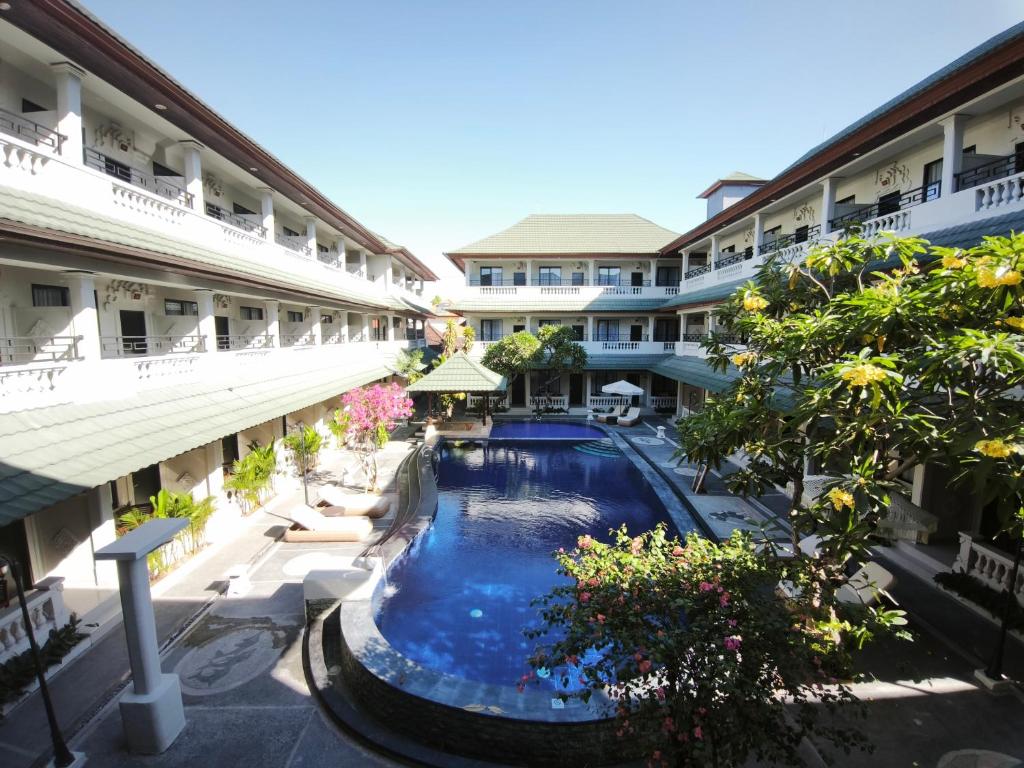 an overhead view of a swimming pool in a building at Casa Mysa Hotel Kuta in Kuta