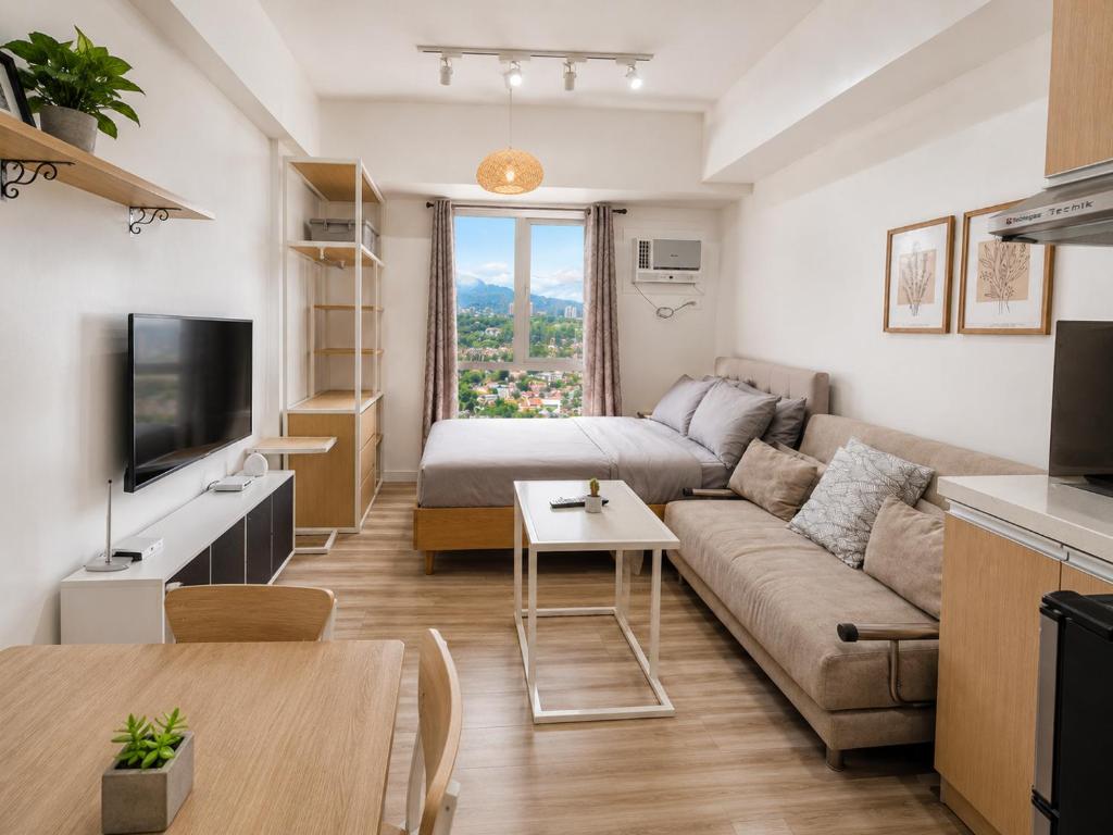 a living room with a couch and a table at Cozy Condo at Avida Tower 4, IT Park Cebu in Cebu City
