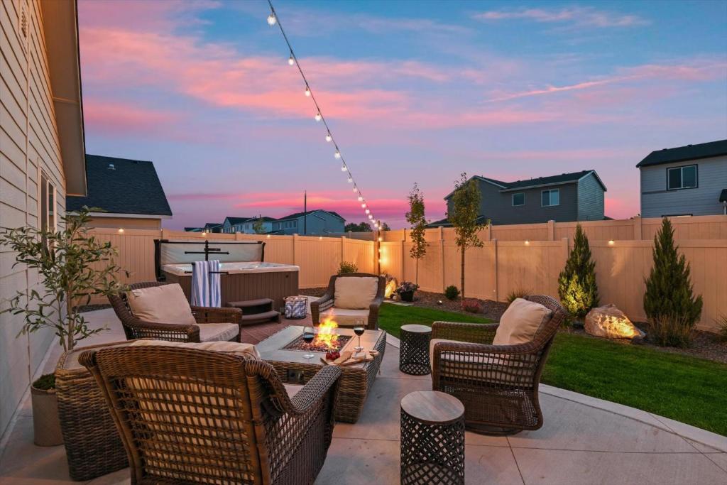 a patio with wicker chairs and a fire pit at Mineral Spa Fire Pit Game Room Mini Split AC in Meridian