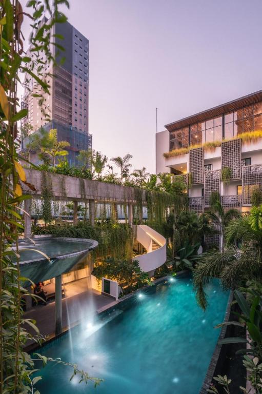 a swimming pool in the middle of a building at Baitong Hotel & Resort Phnom Penh in Phnom Penh