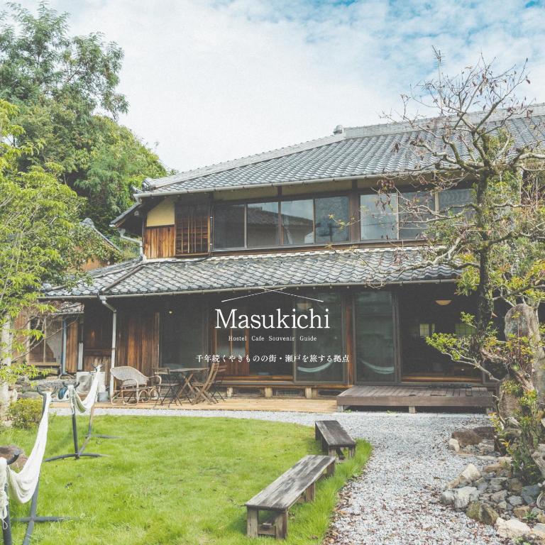 a house with a sign that reads masashiki at Masukichi -hostel,cafe,souvenir,guide- in Seto