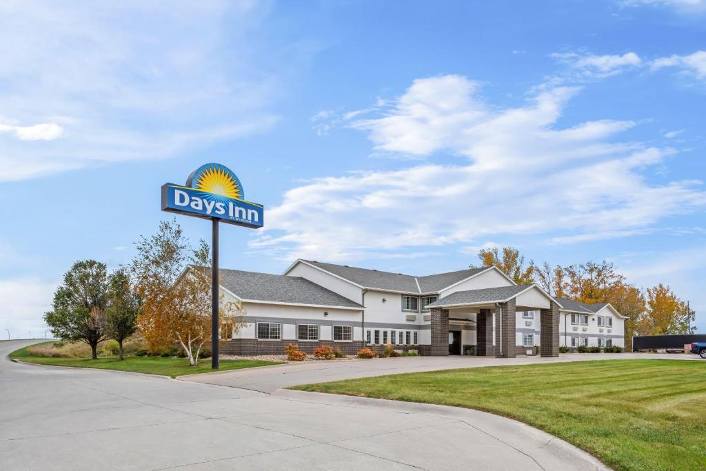 a street sign in front of a house at Days Inn by Wyndham Carroll in Carroll