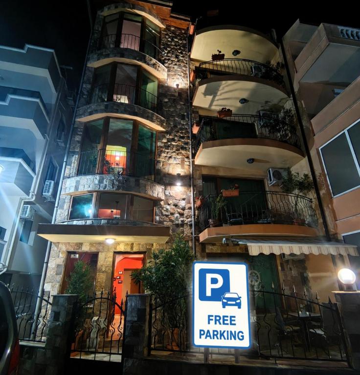 a building with a free parking sign in front of it at Moreno in Sozopol