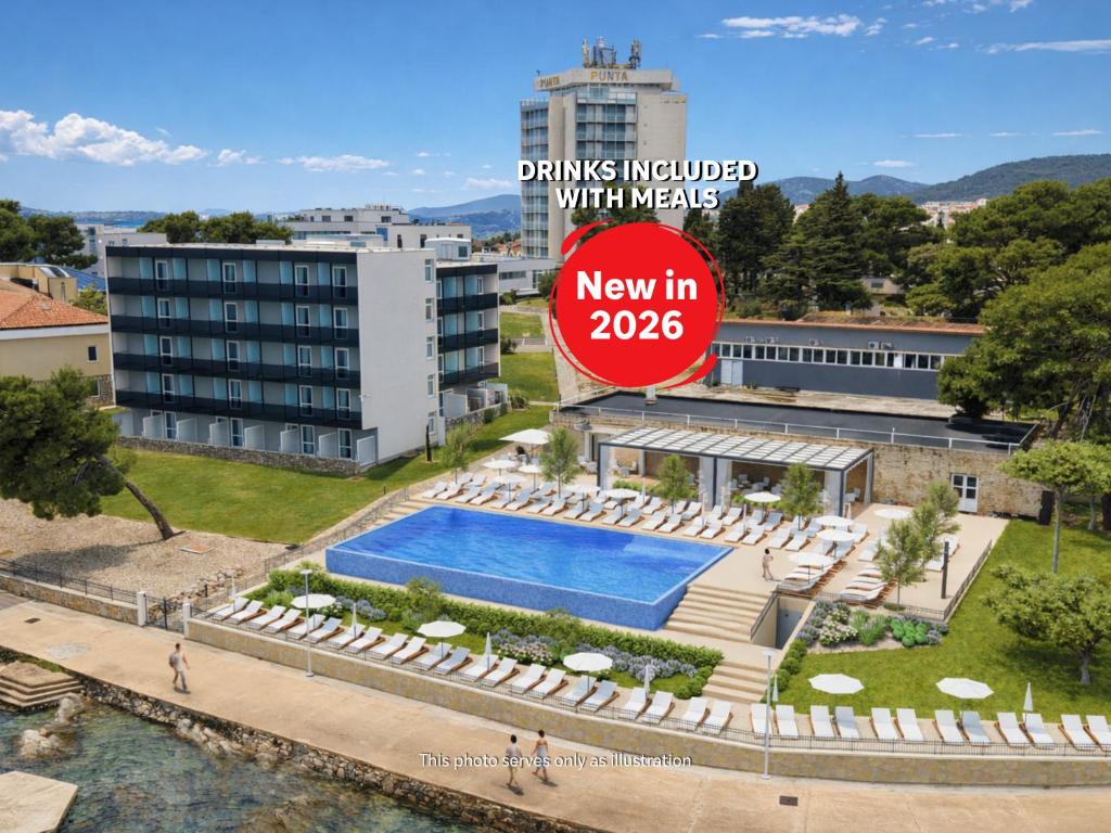 a sign for a hotel with a swimming pool at Villa Arausa in Vodice