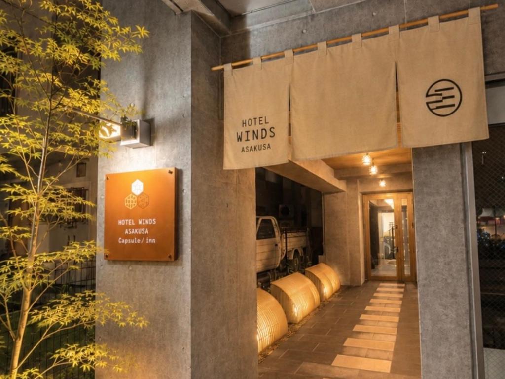 a building with a sign that reads wild winds brewery at HOTEL WINDS ASAKUSA Capsule Inn 浅草 in Tokyo