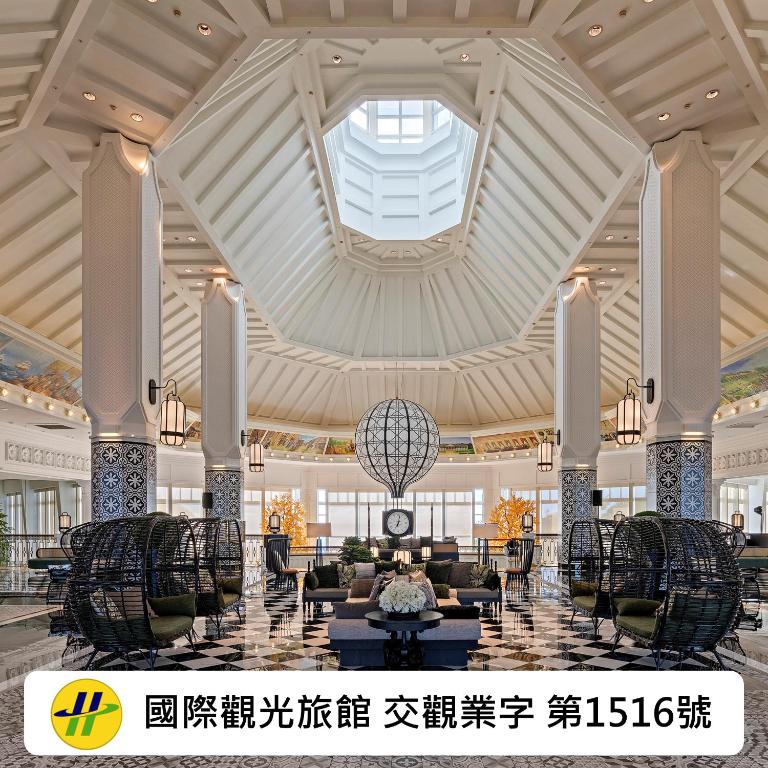 a lobby of a hotel with a large ceiling at Hualien Farglory Hotel in Yanliau