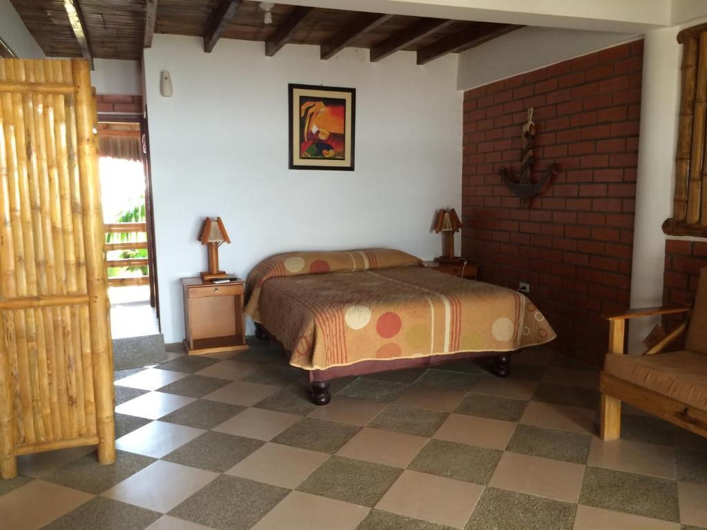 Postel nebo postele na pokoji v ubytování Victor Hugo Hotel