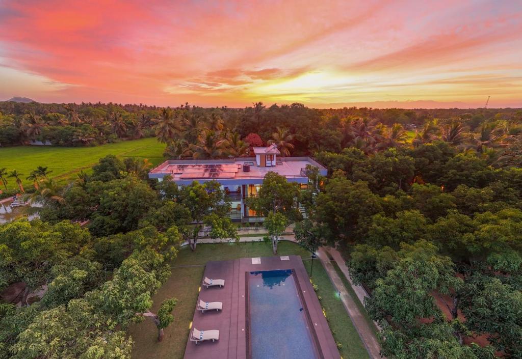 an aerial view of a house with a swimming pool at Villa Oasis in Kataragama