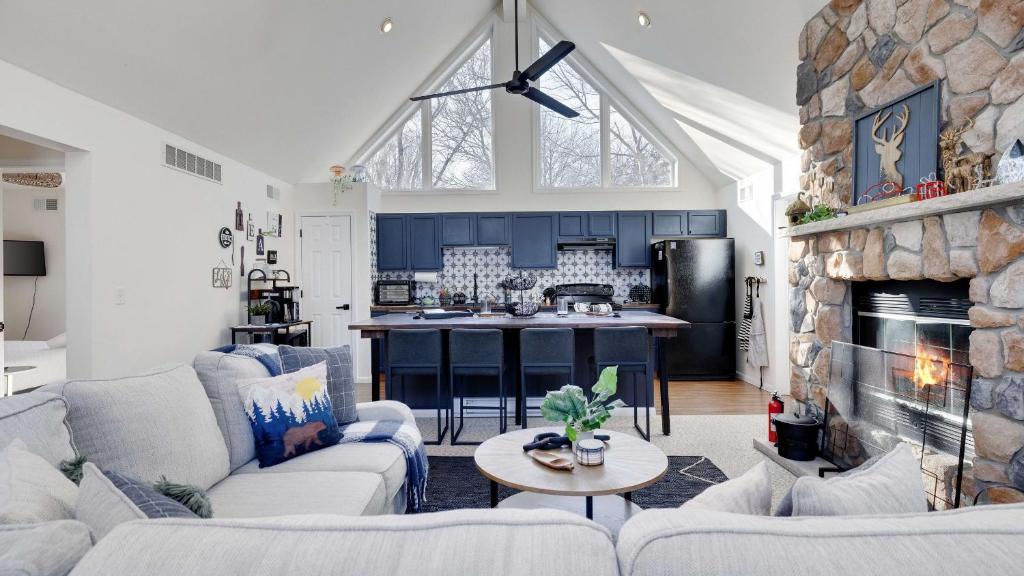 a living room with a couch and a fireplace at Peak Pine by AvantStay in Albrightsville