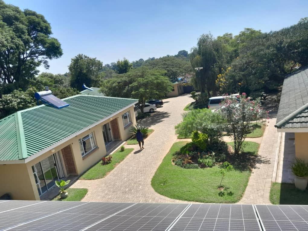 an aerial view of a house with a solar array at Sky Apartments in Harare