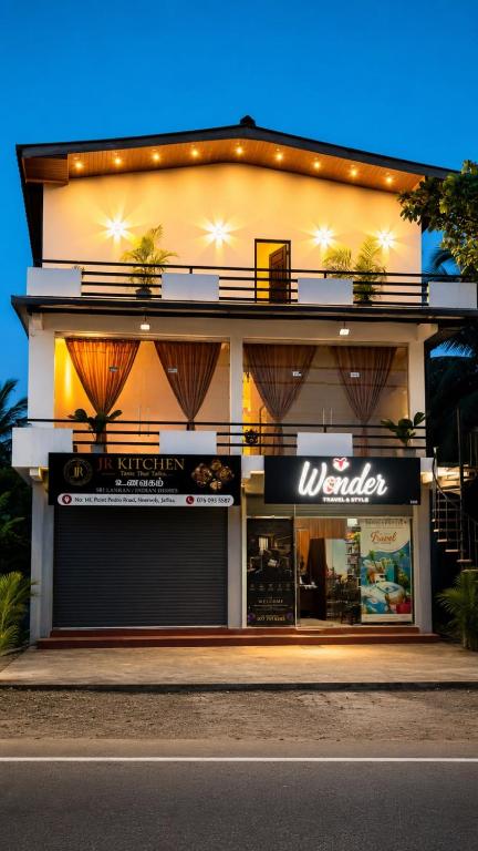 a store front of a building with lights on it at Wonder Stay in Jaffna