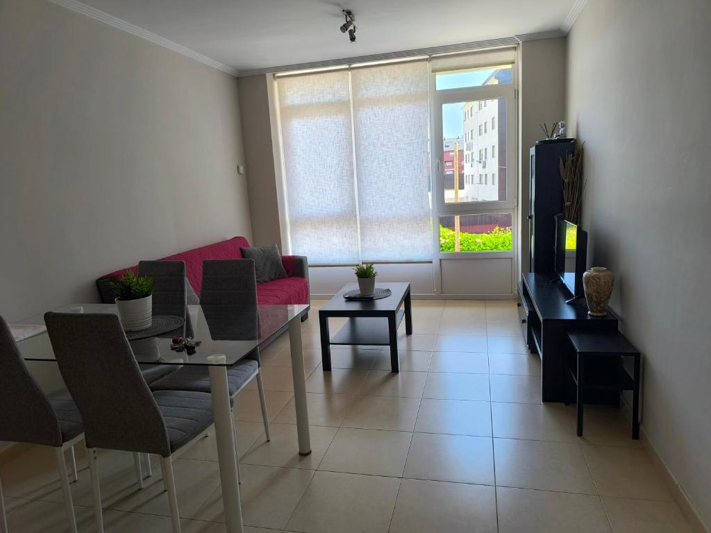 a living room with a couch and a table at Costa do Castro in Foz