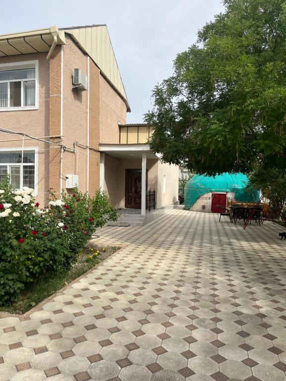 an empty patio in front of a building at NUKUS GUEST HOUSE in Nukus